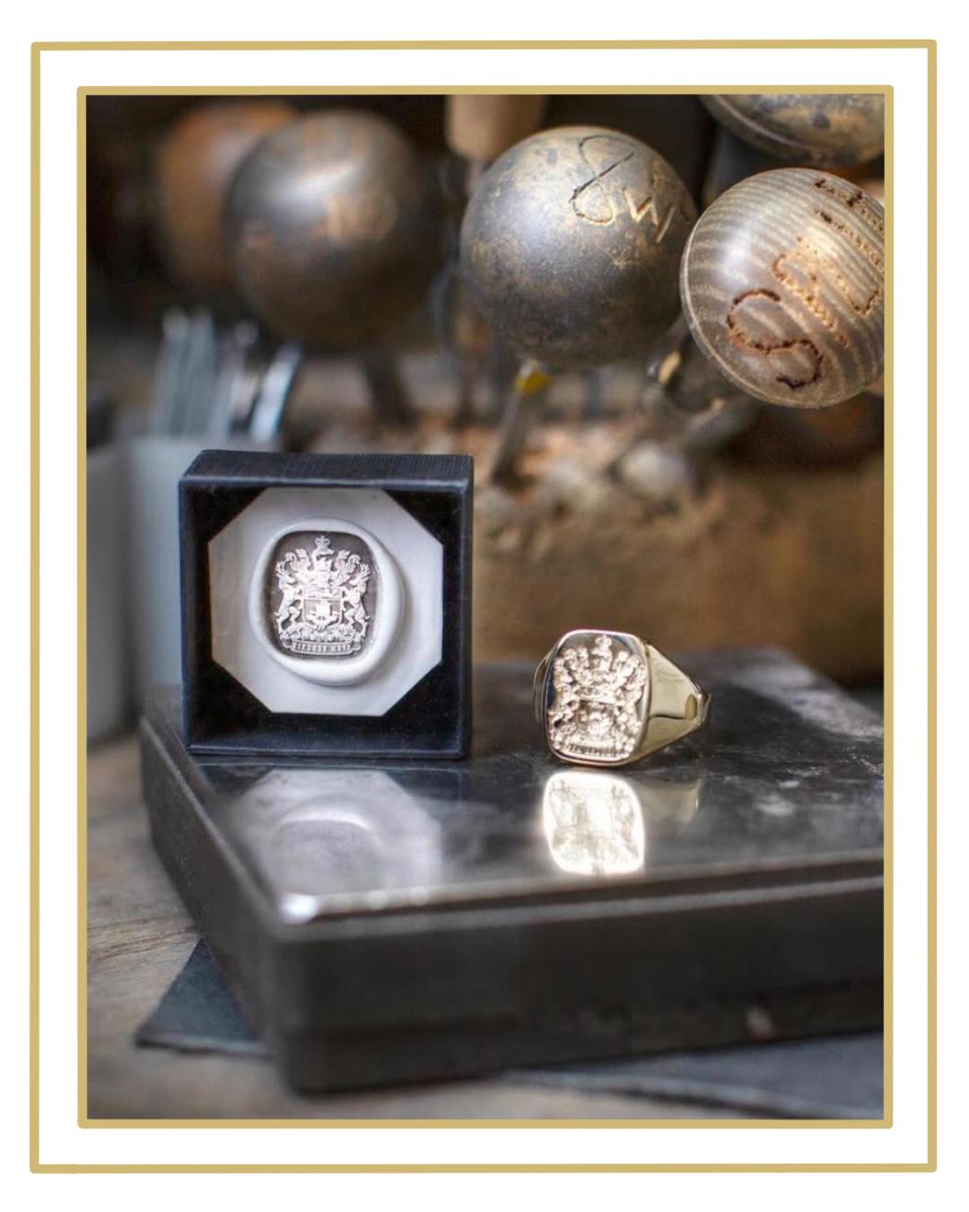 An Atelier Aster signet ring and its matching wax seal photographed on the jeweller's bench